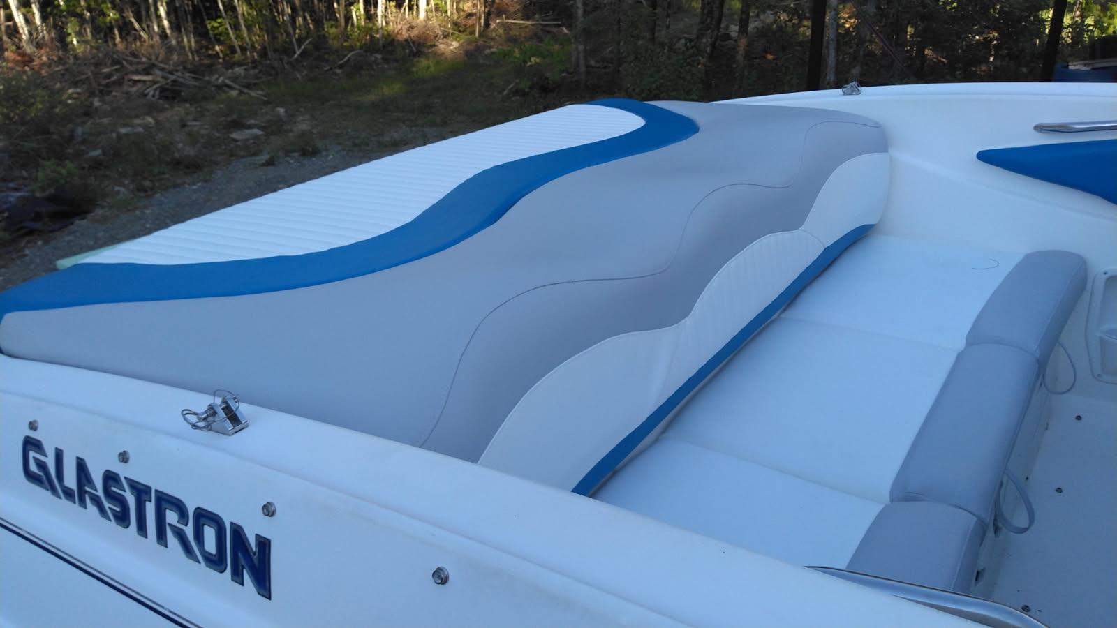 Reupholstered boat interior with new blue and white vinyl