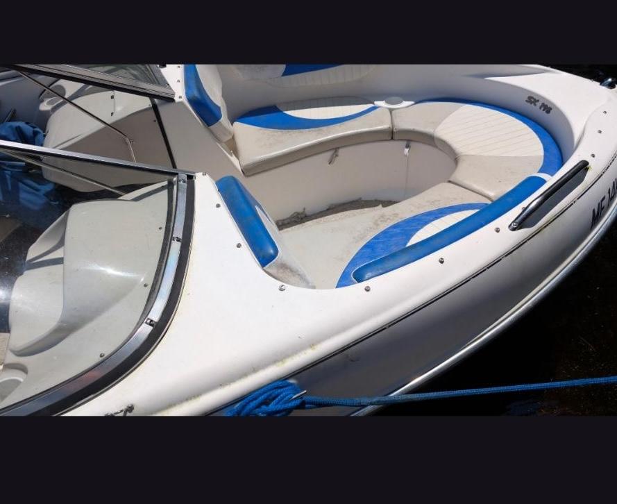 Damaged boat seat vinyl before reupholstery