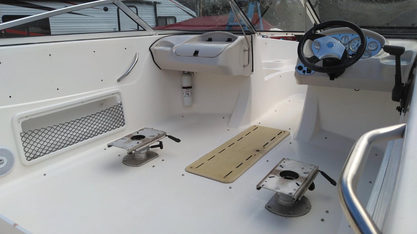 Cleaned white fiberglass boat cockpit after restoration
