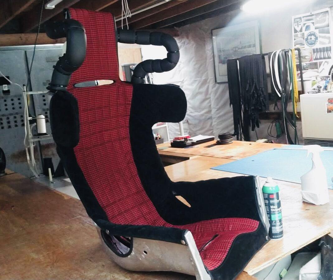 Completed custom racecar seat cover fitted to the full seat shell