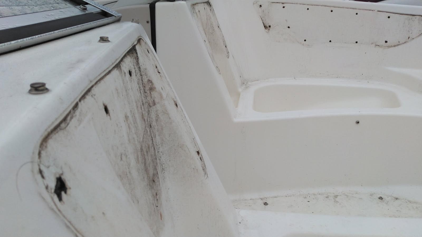 Close view of dirt and mildew on white cockpit surfaces before cleaning
