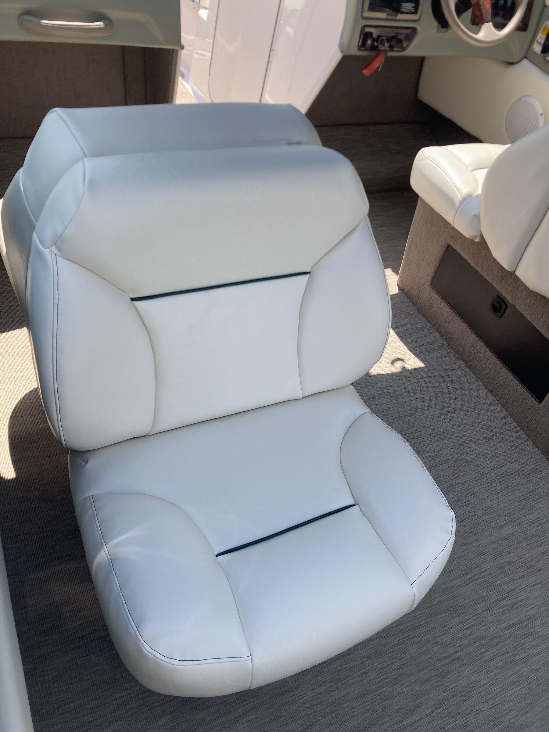 Reupholstered captain's seat with dark gray and green accent panels