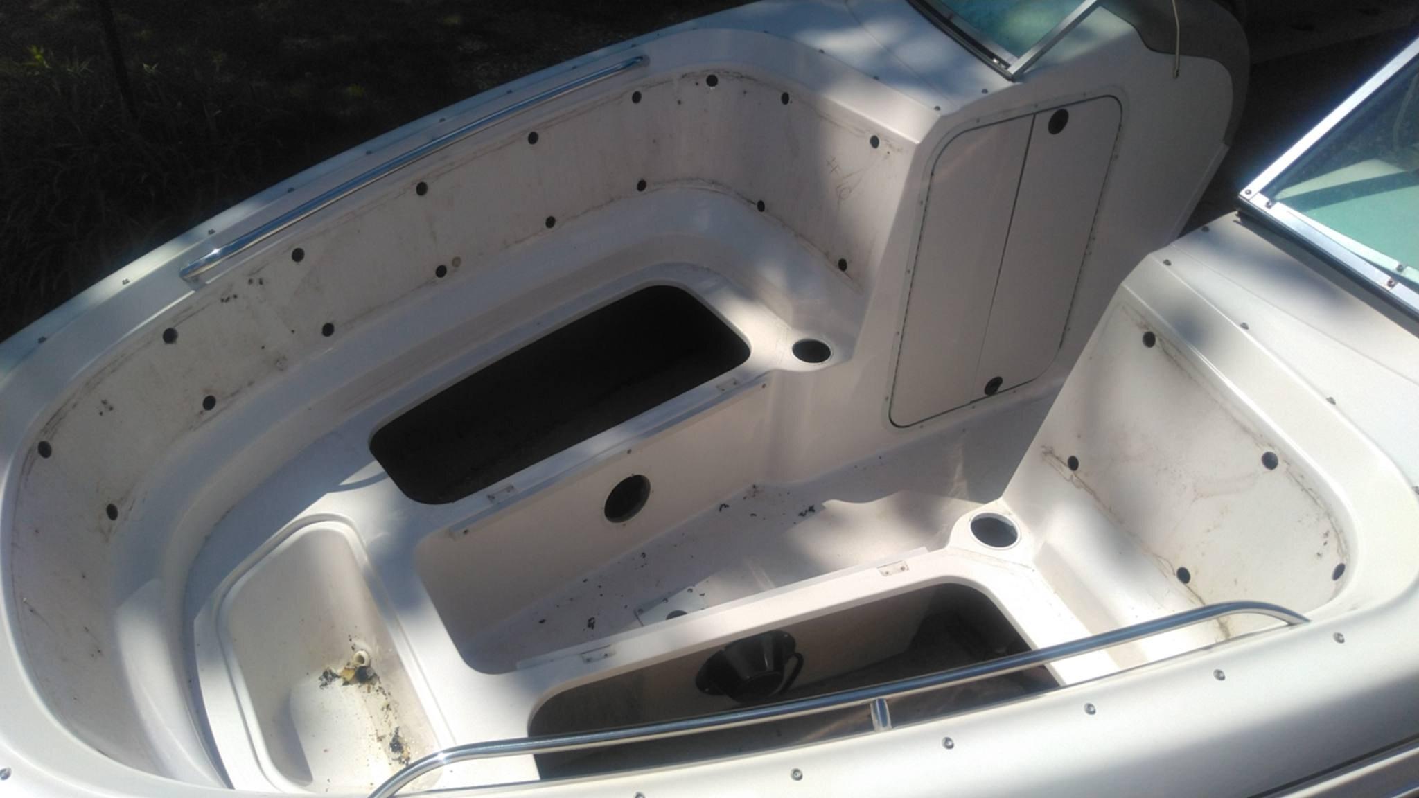 Worn bow seating before new marine upholstery was installed
