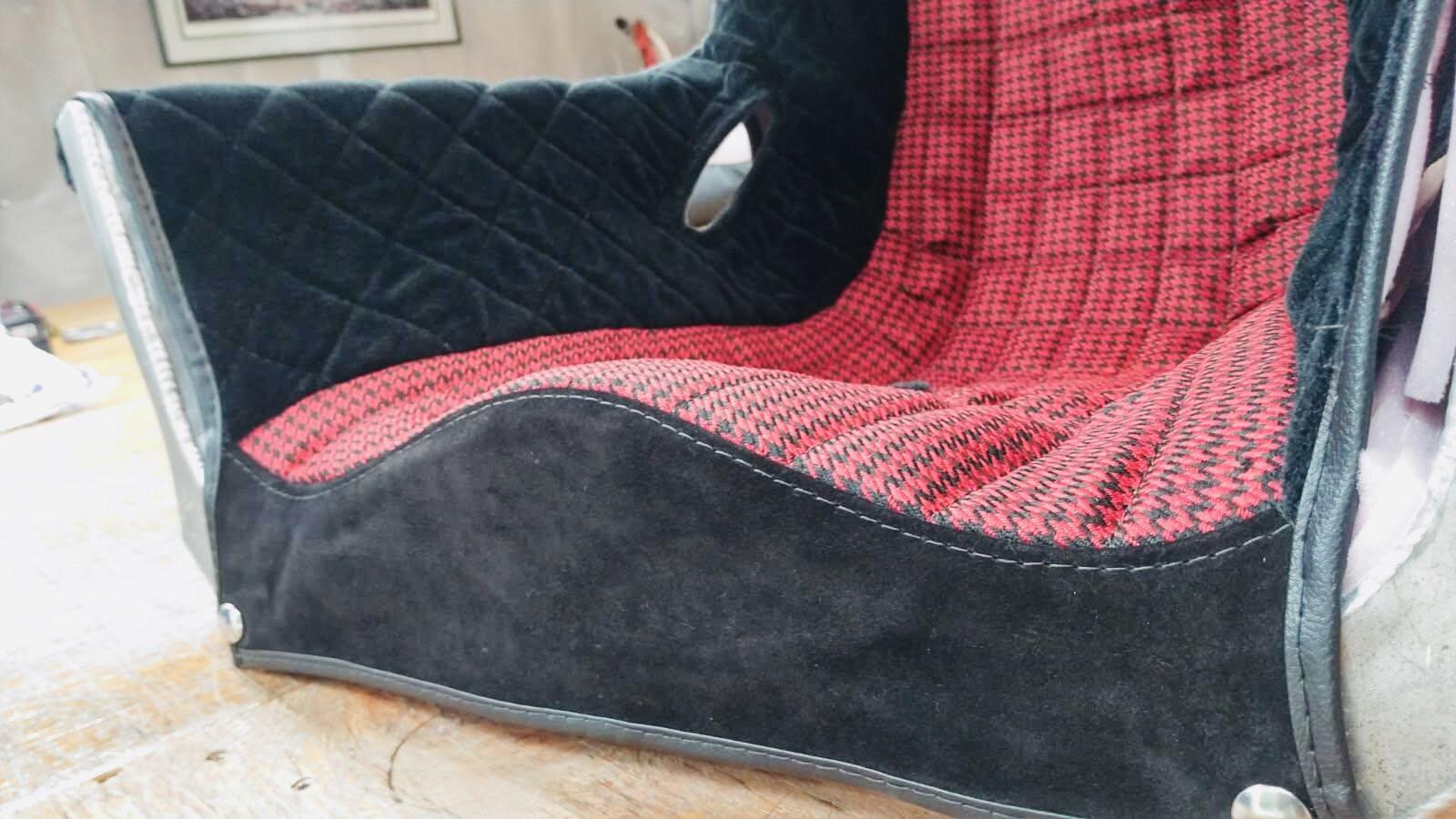 Close view of the finished racecar seat cover stitching and fit